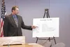 Assembly Member Jim Colver points out how property owners will
be affected by the Mat-Su Borough's proposed budget at a press
conference Wednesday. Photo by RINDI WHITE/Frontiersman