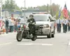 ROBERT DeBERRY/Frontiersman Wasilla police Officer Ben Dudley
uses the department’s only motorcycle to lead the city’s Fourth of
July Parade on Saturday. The Wasilla Police Department has thr