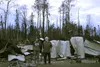 Jared Nott and his father Paul Nott pose in front of one of the structures lost in the McKinley Fire on the Nott family property. Tim Rockey/Frontiersman