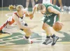 ROBERT DeBERRY/Frontiersman Wasilla senior Jenna Johnson and
Colony’s Jackie Hamann scramble for a loose ball during Friday’s
semi final game.