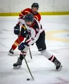 Houston's Anfim Konev shoots the puck during a win over West Valley. Courtesy of Brian Boyett
