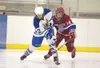 Palmer forward Marissa Ketterman takes a shot on goal as East
High's Craig Hayes puts on the pressure during Thursday's game at
the 7th Annual Curtis C Menard II Memorial Hockey Tournament in