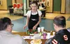 Alicia Burke serves customers their soup and bread during the
Empty Bowls event Tuesday at Teeland Middle School. Photo by Casey
Ressler/Frontiersman