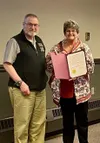 Wasilla Mayor Glenda Ledford presents a proclamation recognizing May as Older Americans Month to WASI Chaplain Tom Stearns. Courtesy photo