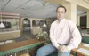 ROBERT DeBERRY/Frontiersman file Joel Costonis sits inside the
Goldminer’s Hotel in Palmer. Costonis had hopes of purchasing the
building and turning it into the 49th Star Inn.