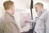 ROBERT DeBERRY/Frontiersman Alaska Railroad Corp. representative
Brian Lindamood, left, gets in a heated conversation about the
Point Mackenzie rail spur with a Valley resident who asked not 