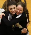 Colony seniors Mikara Klawitter and Jana Jenkins celebrate after the Knights earned a 3-2 win over Palmer in the Nothern Lights Conference Championships title match Saturday at Wasilla High S