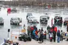 Crowds of people attending the 2015 Mat-Su Kids Ice Fishing Derby surround the table where entries are measured. Prizes in the raffle coinciding with the derby included a four-wheeler, an ice