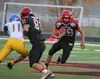 Houston senior Vanu Mose cuts inside off a Wyatt Mulhaney block during a 55-27 win over Barrow Saturday at Houston High School. Mose rushed for a career-high 209 yards in the win. Jeremiah Ba