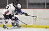 Kenai Central's Will Howard and Palmer's Liam Hilscher battle for the puck during the Peninsula Ice Challenge on Thursday, Oct. 31, 2024, at the Kenai Multi-Purpose Facility in Kenai, Alaska.