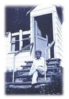 Photo by Wilma Knox. Author Louise Potter sits on the steps of
her Wasilla home. Photo courtesy Alaskana Books.
