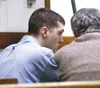 Ricky Shivers, 17, converses with attorney Eugene Cyrus just
before the jury came back with a guilty verdict in Palmer Superior
Court Thursday. Photo by MARY SPEARS/Frontiersman.