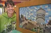 Valley artist Kim Strickland with her tile mossaic piece for Palmer’s ‘Water Towers on Parade.’ ROBERT DeBERRY/Frontiersman.com