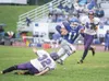 ROBERT DeBERRY/Frontiersman Palmer junior A.J. Corbin moves
around Lathrop junior Matt McCoy and sprints toward the end zone
for a 23-yard touchdown run during the third quarter of a 46-0 win