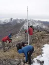 Volunteers from the Friends of the Chugach National Forest
Avalanche Information Center work to install a weather station on
top of Marmot Ridge. The information recorded will help skiers,
hi