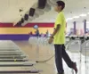 Paul Raphael-Crume, 15, watches his ball roll down the lane
during Saturday’s adoption celebration event at North Bowl in
Wasilla. The Raphael twins were in foster care for about 10 years
(in