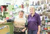 New owner Jeanne Perkins stands with former owner Linda Pendergrass in the Stamp Cache in Palmer Tuesday shortly after signing the papers to complete the sale. HEATHER A. RESZ/Frontiersman