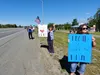 About 100 people gathered to show their support for police officers across the nation during a 'Back the Blue' rally off the Parks Highway near Wasilla Lake Saturday. Jacob Mann/Frontiersman