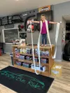 Spencer Richardson’s daughter Ava holds the giant receipt listing over 300 items that he bought for local students. Courtesy photos