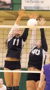 Mary Klapperich and Kortnie Swenson block a Skyview shot during
Thursday’s opening round of the Northern Lights Conference
Volleyball Championships at Colony High School. The Knights upset
th