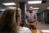 Community Resilience Coordinator Adam Hooven (right) speaks with co-worker and non- appropriated funds employee Debbie Shiess, both assigned to the 773rd Force Support Squadron, at the 773rd 