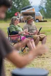 One of the many couples in the Drum and Rhythm Circle follow Gale Jackson's lead during the morning activities at Vanstock. J. David McChesney/Frontiersman