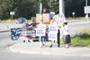 Joe Miller for U.S. Senate supports wave signs on the corner of the Glenn and Palmer-Wasilla highways in Palmer along side perennial corner protestor Sidney Hill, who also is running as an in