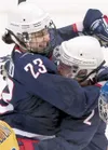 MATT SLOCUM/Associated Press USA’s defenseman Kerry Weiland,
left, and forward Erika Lawler celebrate a goal by forward Jenny
Potter, not shown, in the third period of a Monday women’s
semifi