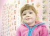 ROBERT DeBERRY/Frontiersman Three-year-old Caitlin Racenet is
awaiting the arrival of a new assistance dog. The toddler suffers
from a condition that causes seizures, and the trained dog will