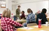 U.S. Air Force Col. Patricia Csànk, the commander of Joint Base Elmendorf-Richardson and the 673d Air Base Wing, speaks to attendees of the JBER Spouse Symposium held at JBER, Alaska, Oct. 16