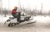 ROBERT DeBERRY/Frontiersman Chris Olds of Wasilla powers over a
series of whoops at the start of the Iron Dog on Sunday on Big
Lake. Olds and teammate Tyler Huntington won the race today.