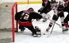 Houston goalie Dylan Shaffer makes a save against North Pole. Bruce Eggleston/matsusports.net