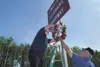 Tony Shelton and Kevin Burke attach a wreath to the Mat-Su
Veterans' Highway sign near the intersection of Church and Seldon
Road. The wreaths were purchased by the Palmer Elks Lodge annd the