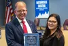 Dr. Lisa Parady, right, Executive Director of Alaska Superintendents Association, surprised Dr. Randy Trani during the Matanuska-Susitna Borough School District regular school board meeting o