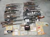 A six-month effort by the Alaska Bureau of Alcohol and Drug
Enforcement's Mat-Su unit resulted in the confiscation of numerous
weapons, cash and drugs. Photo courtesy of Alaska State
Troopers