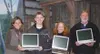 From left, Suzanne Rudolph of The Children's Miracle Network,
Nick Williams of Williams Communications, Lindy Gregory and David
McDonald of Williams Communications show off the three Dell lap