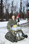 Andrew Liebig sits in his Active TrackChair in the driveway of his home Wednesday morning. Liebig said the chair has allowed him to resume the outdoor activities he loves. It’s made him want 