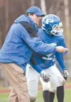 ROBERT DeBERRY/Frontiersman Palmer Moose head coach Rod
Christiansen works with the varsity team during practice Thursday
afternoon.