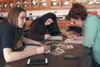 AP Biology students Natalia Wanser, Sierra Berg and Kate Corneliussen research together the interactions between species and calculating energy flow in specific ecosystems in Gorongosa Nation