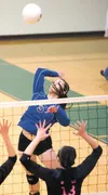 Morgan Morfe reaches for a kill during Palmer’s win over Kodiak during last season’s Northern Lights Conference Championships. Morfe will play at Union University in Jackson, Tenn., in the fa