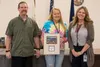Public Works Director Ray Russell (left), Mayor Virgie Thompson (middle), and City Clerk Sonya Pevan (right) pose for a photo after accepting the donated land from the Great Land Trust. Court