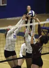 Palmer's Mallory Bradford, left and Erika Spencer battle at the net against Ketchikan's Kristy Halvorsen on Thursday, Oct. 22, 2015 at Palmer High. Matt Tunseth/Frontiersman