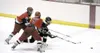 JEREMIAH BARTZ/Frontiersman Colony forward Alex Conrad tries to
slice between Wasilla'€™s Jesse Gittlein, left, and Trent Wohlers
during the first period of Wasilla'€™s 6-2 win over the Knigh
