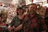 Penny and Joe Muth smile for a photo amidst the 'organized chaos,' as Penny calls it, of their antique shop and home, Country Peddlers. In their efforts to sell all their unique items before 