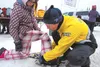 A 12-year-old learns how to fasten snowshoes. Photo courtesy Patty Sullivan/Mat-Su Borough