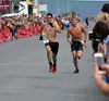Ben Marvin and Luke Jager sprint the final stretch of the Mount Marathon men’s race Wednesday, July 4, 2018, in Seward. Marvin, of Palmer, finished fifth. Jeff Helminiak/Peninsula Clarion
