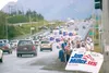 ROBERT DeBERRY/Frontiersman Supporters of Joe Miller for U.S.
Senate wave signs at the corner of the Parks and Palmer-Wasilla
highways Monday evening. Miller is running against U.S. Sen. Lisa