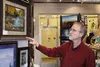 Shane Lamb points toward a piece in his Palmer gallery. Lamb announced this week he will have to close his store. Jacob Mann/Frontiersman