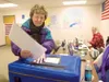 Jan Johnson puts her early ballot in the ballot box Monday at
the polling place on Bogard Road. Polls will be open today for the
Mat-Su Borough Mayoral election from 7 a.m. to 8 p.m. There ar