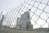 ROBERT DeBERRY/Frontiersman The former Matanuska Maid Creamery
sits behind a chain link fence in downtown Palmer. The land is
owned by the state Board of Agriculture and Conservation. Palmer
